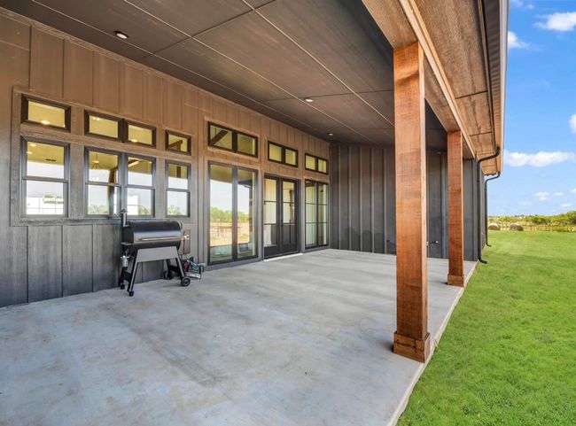 View of patio featuring a grill | Image 6