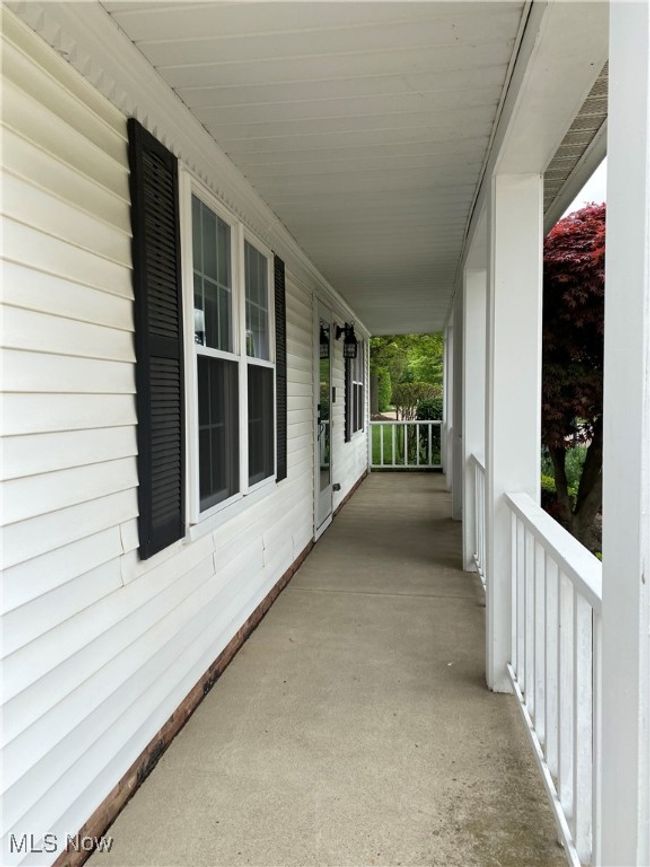 View of patio with a porch | Image 6
