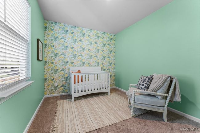 Carpeted bedroom featuring wallpapered walls, baseboards, and an accent wall | Image 37