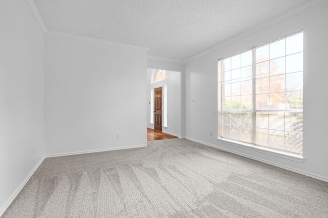 The formal living room overlooks the front yard. | Image 7