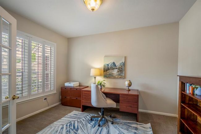 The private study offers a quiet retreat, complete with plantation shutters on the front-facing window for natural light and privacy. | Image 7