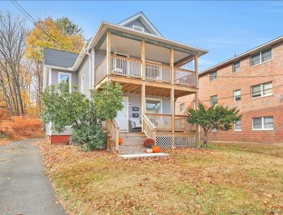 Welcoming entrance with driveway and updated decking | Image 1