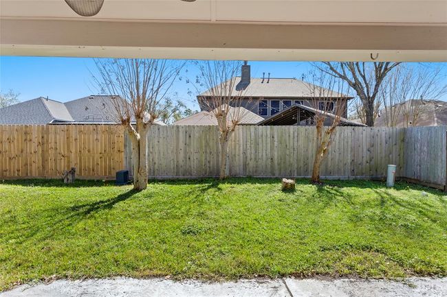 Backyard with a privacy fence. | Image 19