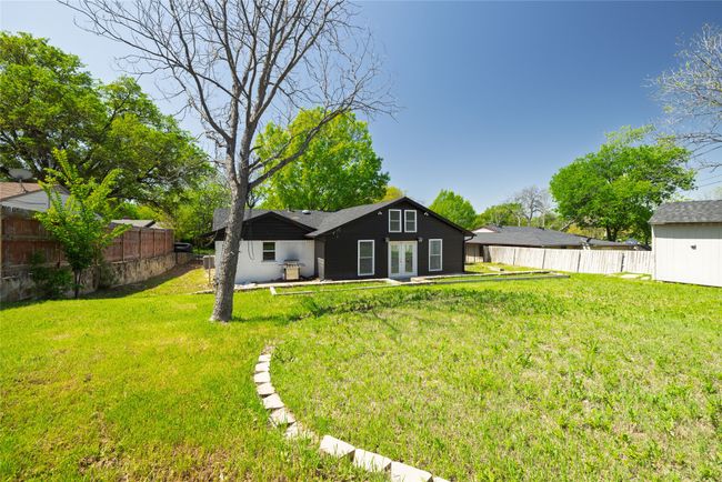 Rear view of property with a yard and a fenced backyard | Image 37