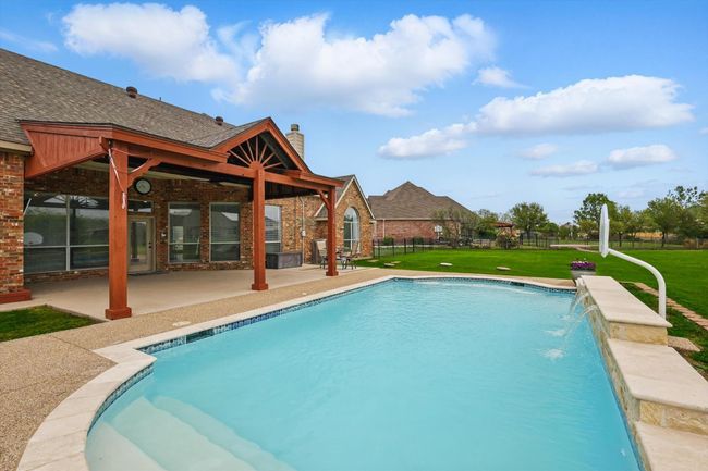 Generous sized pool with water falls. Brand new plaster, so THIS ONE is ready for summer! | Image 34