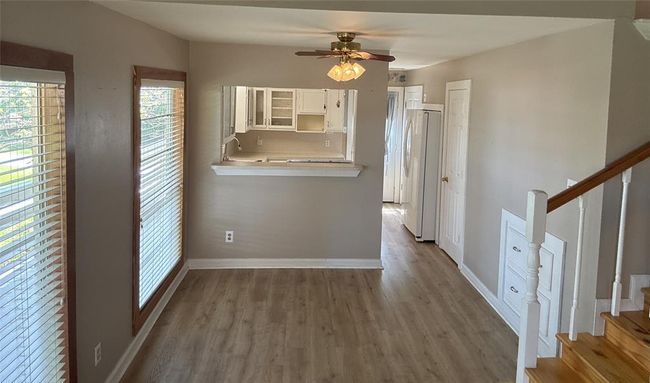 Charming dining space seamlessly connected to the kitchen. | Image 17