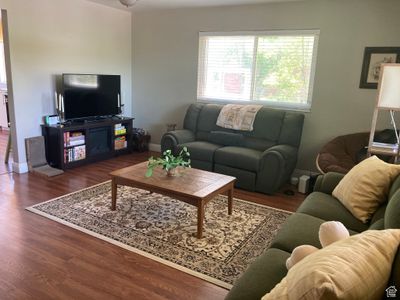 Living room with dark hardwood / wood-style flooring | Image 3