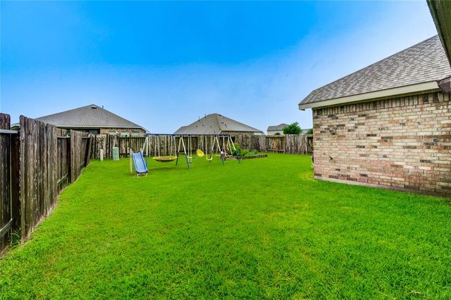 Large fully fenced back yard with plenty of room for a garden or a pool! | Image 39