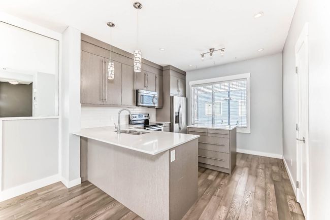 52 - 111 Rainbow Falls Gate, Townhouse with 2 bedrooms, 3 bathrooms and 2 parking in Chestermere AB | Image 7