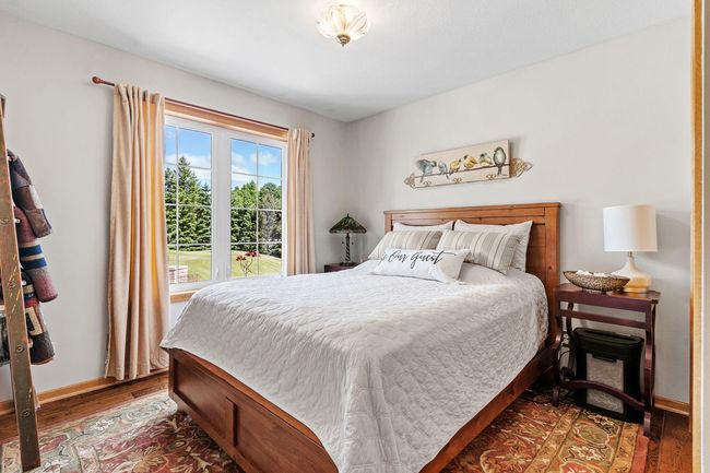 Bedroom 2 faces the beautiful patio sitting area out front | Image 32