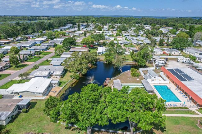 Fox Run community with view of Clubhouse, shuffle board courts and one of two pools. | Image 31
