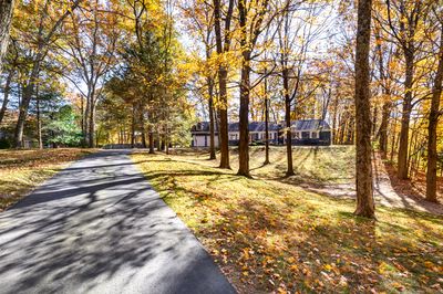 Long, beautiful driveway leading up to the two car garage | Image 2