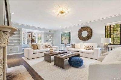 Living room featuring ornamental molding and hardwood floors | Image 3