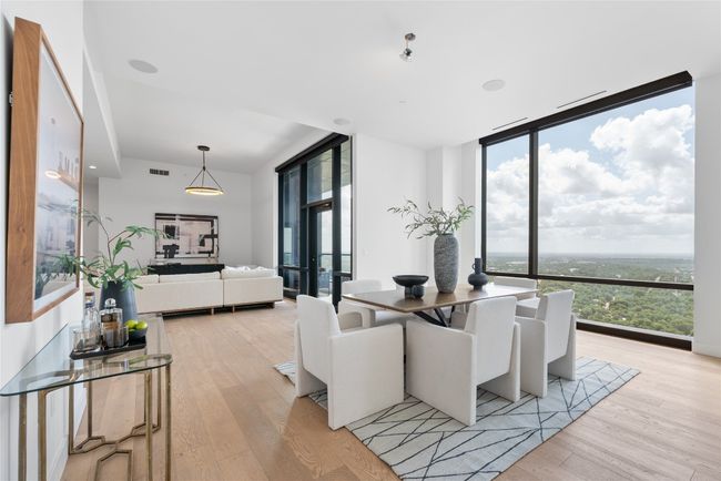 Dining area featuring floor to ceiling windows and light wood finished floors | Image 36