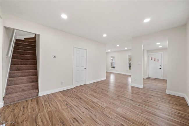 Unfurnished living room featuring light wood-type flooring | Image 5
