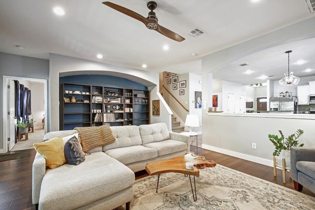 The living room is adjacent to the kitchen making entertainment and conversing with family/friends a breeze. | Image 9