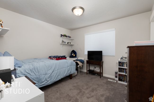 Bedroom with carpet flooring and baseboards | Image 23