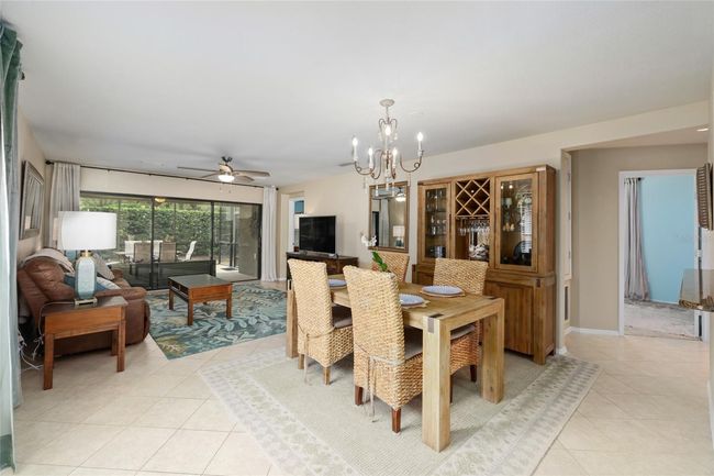 Centrally located dining space with quick access to the kitchen and outdoor living. | Image 8