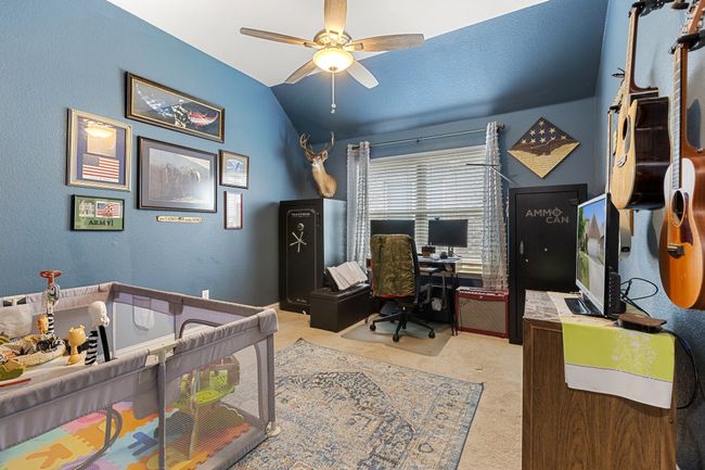 Carpeted bedroom featuring vaulted ceiling | Image 24