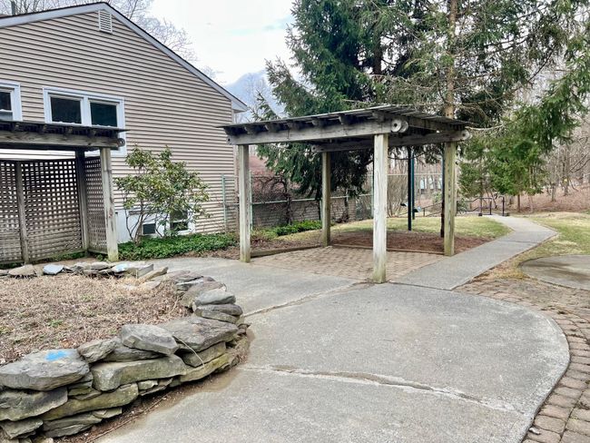 View of patio / terrace featuring a pergola and fence | Image 6