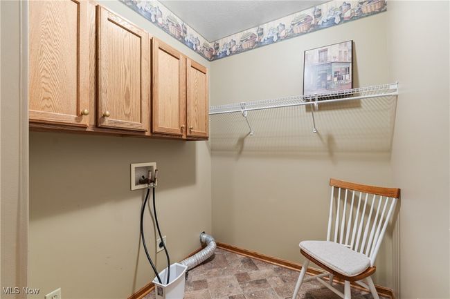 First floor laundry with cabinet space. | Image 22