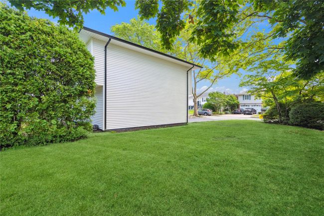 View of property exterior featuring a yard | Image 39