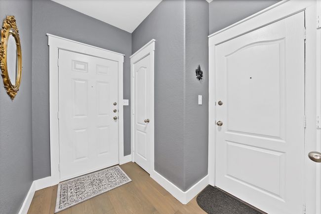 Foyer entrance featuring wood finished floors and baseboards | Image 26