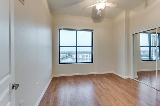 Ideal for guests, a home office, or multi-generational living, the second bedroom mirrors the home’s overarching elegance. | Image 33