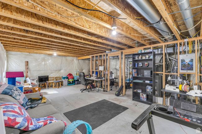 View of unfinished basement with room for a bedroom, bathroom, storage, and family room. | Image 21