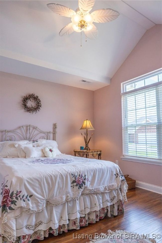 Guest bedroom has vaulted ceiling | Image 10