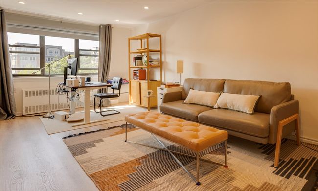 Living area with radiator, wood finished floors, and recessed lighting | Image 11
