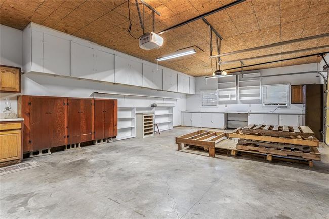 Garage with a garage door opener | Image 60