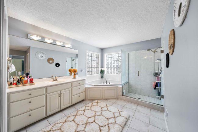 Bath has a separate shower, tub and dual sinks | Image 57