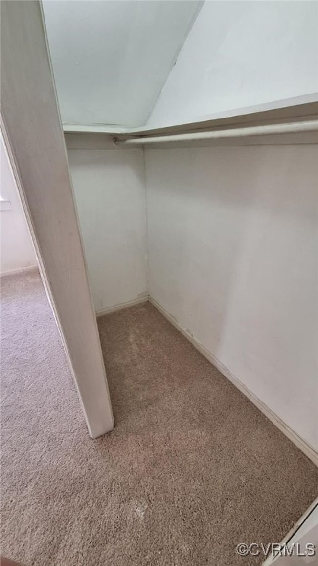 Spacious closet with carpet floors | Image 31