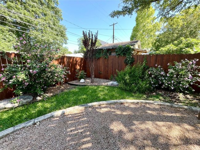 View of fenced backyard | Image 34