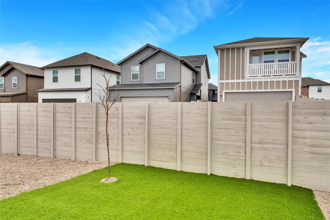 View of yard with a fenced backyard and an attached garage | Image 11