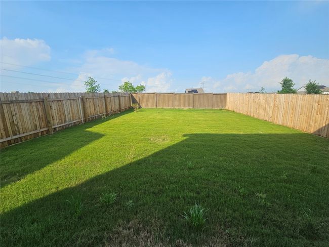 View of yard featuring a fenced backyard | Image 32