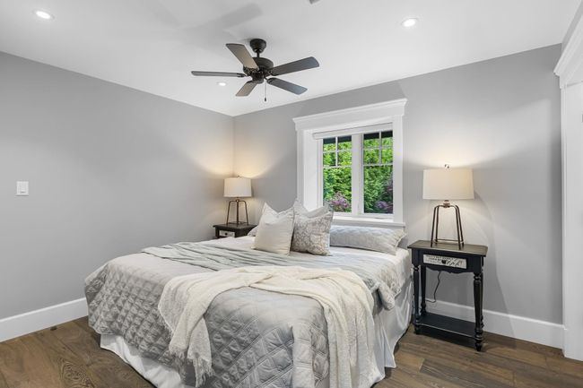 Bedroom featuring baseboards, dark wood-style flooring, recessed lighting, and a ceiling fan | Image 25