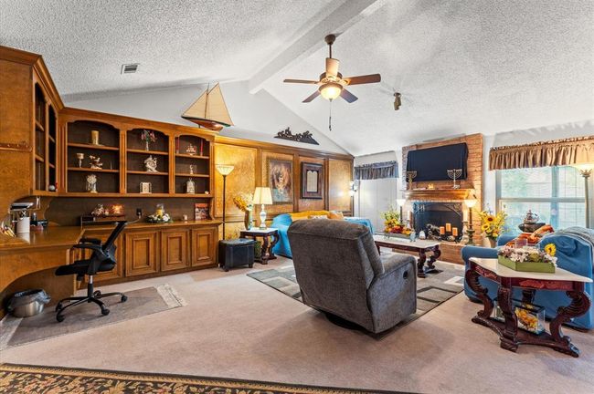 Amazing Living Room with High Ceilings, a nice Fireplace, and beautiful Built-in workspace! | Image 11