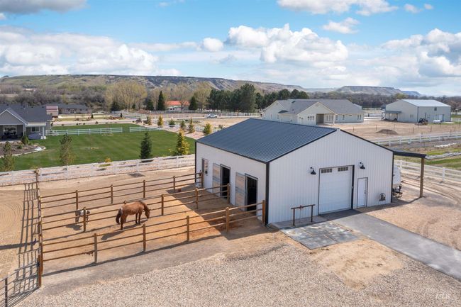 View of outbuilding with an exterior structure, a rural view, driveway, and a mountain view | Image 4