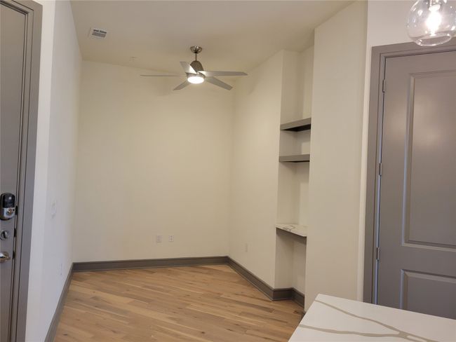 Unfurnished bedroom with light wood-type flooring and baseboards | Image 10