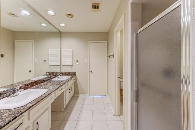 Another view of the primary bathroom with walk-in shower and separate toilet room. | Image 18