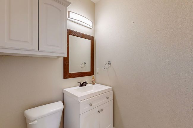 Bathroom featuring toilet and vanity | Image 31