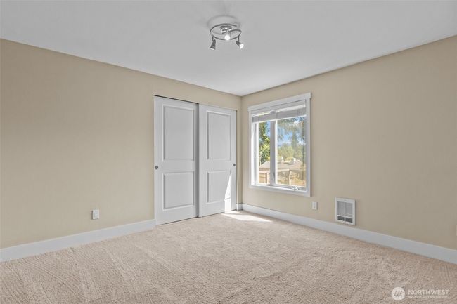 The 2nd Bedroom has east facing windows and gets plenty of natural light. | Image 22