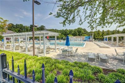 View of swimming pool featuring a patio area and a pergola | Image 2