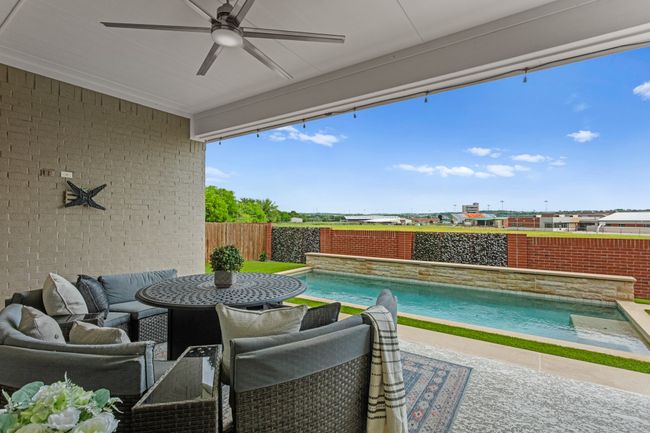 This can be your view! Step outside the patio door on to your large covered patio overlooking the pool. Ready to mount the TV! | Image 35