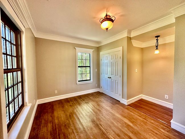 Spare room featuring wood finished floors and ornamental molding | Image 6