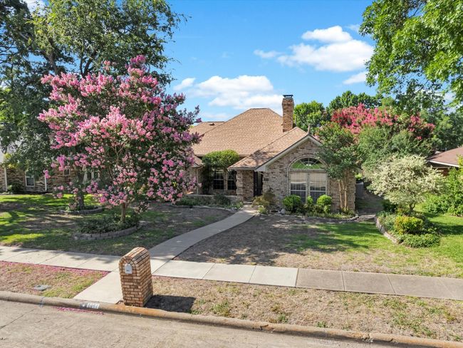 The lush landscaping offers colorful hues and picturesque views. | Image 4