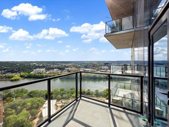 Balcony featuring a water view | Image 8