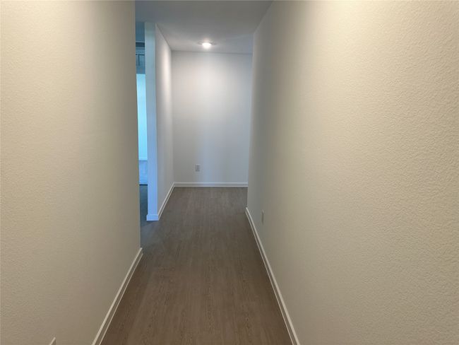 Corridor featuring dark wood-style floors and baseboards | Image 8